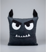 A square plush monster pillow designed as a cute werewolf for Halloween. It features pointy furry wolf ears on top, wide eyes, and white fangs protruding from its mouth. The mouth functions as a deep storage pocket.